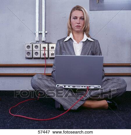 Stock Photo - Portrait of businesswoman using laptop . Fotosearch