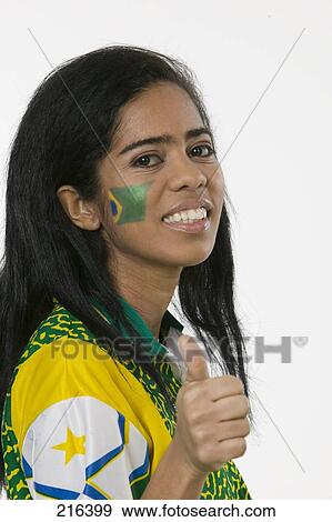 Stock Photo - Portrait of female brazilian soccer fan making thumbs up sign . Fotosearch
