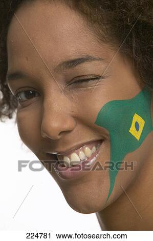 Portrait of female soccer fan winking and smiling View Large Photo Image Stock Image - Portrait of female soccer fan winking and smiling . Fotosearch
