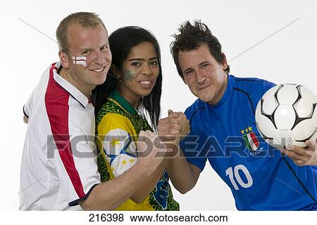Portrait of three soccer fans cheering View Large Photo Image Stock Photo - Portrait of three soccer fans cheering . Fotosearch