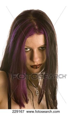 Stock Photo - Portrait of young woman looking serious . Fotosearch