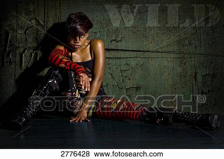 Stock Photo - Portrait of young woman posing . Fotosearch