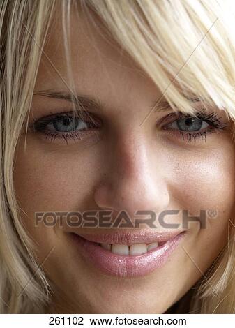 Portrait of young woman smiling View Large Photo Image Stock Image - Portrait of young woman smiling . Fotosearch