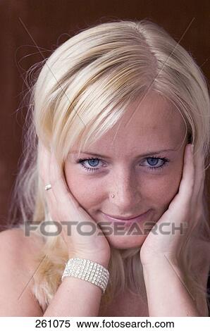 Stock Photography - Portrait of young woman smiling . Fotosearch