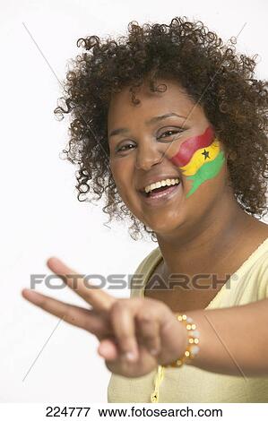 Portrait of young woman with Ghanaian flag painted on her face View Large Photo Image Stock Photo - Portrait of young woman with Ghanaian flag painted on her face . Fotosearch