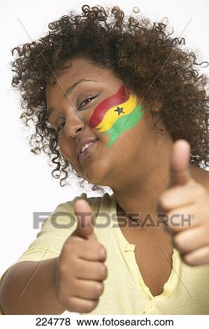 Portrait of young woman with Ghanaian flag painted on her face View Large Photo Image Stock Photo - Portrait of young woman with Ghanaian flag painted on her face . Fotosearch
