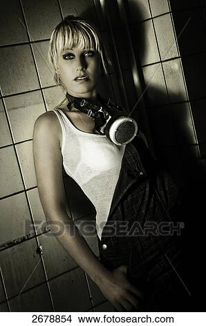 Picture - Portrait of young woman with pit lamp around her neck . Fotosearch