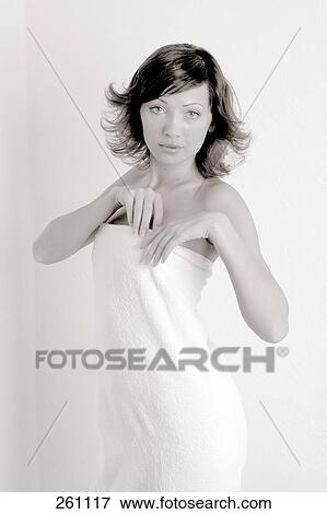 Portrait of young woman wrapped in towel View Large Photo Image Stock Photo - Portrait of young woman wrapped in towel . Fotosearch