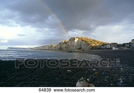 Rainbow behind a cliff on a coast, Yport, Normandie, France View Large Photo Image Stock Photo - Rainbow behind a cliff on a coast, Yport, Normandie, France . Fotosearch
