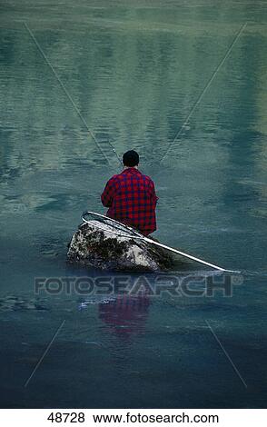 Rear view of fisherman fishing in river, Chilkoot River, Haines, Alaska, USA View Large Photo Image Stock Photo - Rear view of fisherman fishing in river, Chilkoot River, Haines, Alaska, USA . Fotosearch