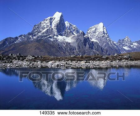 Stock Photography - Reflection of mountains in lake, Taboche, Himalayas, Khumbu, Nepal . Fotosearch