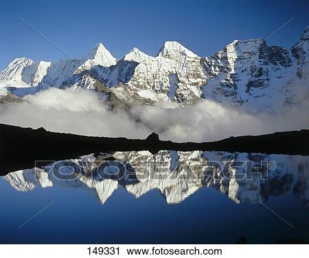 Reflection of snowcapped mountain in lake, Glacial Lake, Khumbu, Nepal View Large Photo Image Stock Image - Reflection of snowcapped mountain in lake, Glacial Lake, Khumbu, Nepal . Fotosearch