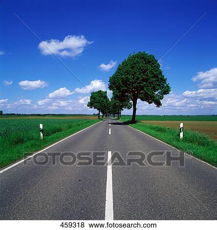 Road running through landscape, North Rhine-Westphalia, Germany View Large Photo Image Stock Photo - Road running through landscape, North Rhine-Westphalia, Germany . Fotosearch