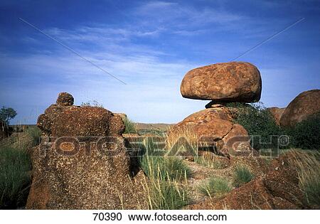 Stock Image - Rock formations on landscape, Devils Marbles Conservation Reserve, Tennent Creek, Northern Territory, Australia . Fotosearch