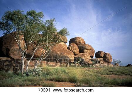 Stock Image - Rock formations on landscape, Devils Marbles Conservation Reserve, Tennent Creek, Northern Territory, Australia . Fotosearch