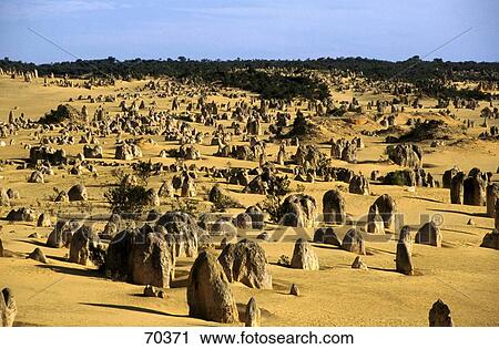 Stock Image - Rock formations on landscape, Pinnacles Desert, Nambung National Park, Australia . Fotosearch