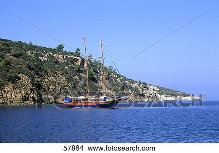 Sailboat at the coast View Large Photo Image Picture - Sailboat at the coast . Fotosearch