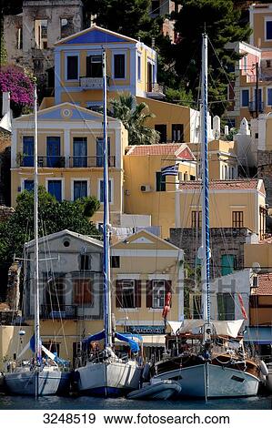 Sailing boats at the port of Symi, Greece View Large Photo Image Stock Photo - Sailing boats at the port of Symi, Greece . Fotosearch