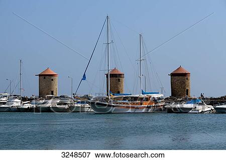 Sailing boats in the port of Rhodes, Greece View Large Photo Image Stock Photo - Sailing boats in the port of Rhodes, Greece . Fotosearch