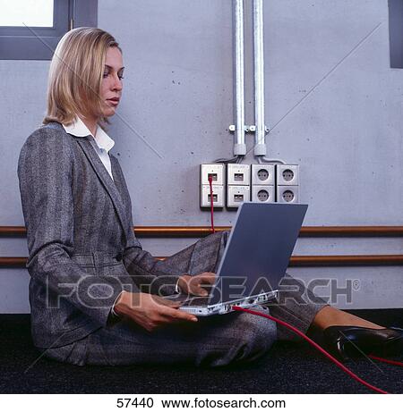 Side profile of businesswoman using laptop in office View Large Photo Image Stock Image - Side profile of businesswoman using laptop in office . Fotosearch
