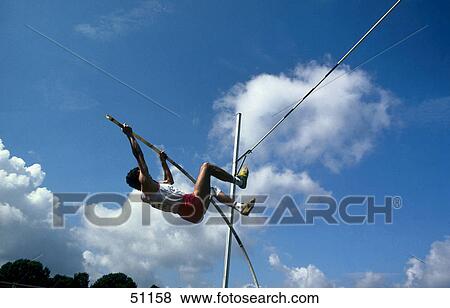 Side profile of man pole vaulting View Large Photo Image Stock Photo - Side profile of man pole vaulting . Fotosearch