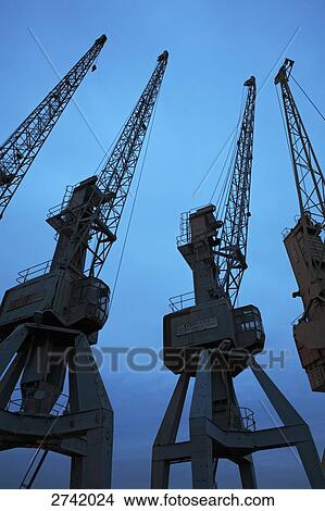 Silhouette of cranes at harbor, Hamburg, Germany View Large Photo Image Picture - Silhouette of cranes at harbor, Hamburg, Germany . Fotosearch