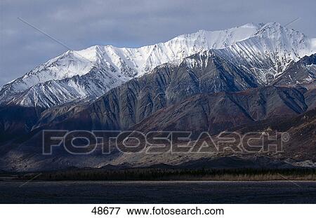 Stock Photo - Snow covered mountain range, Alaska Range, Alaska, USA . Fotosearch