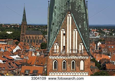 Stock Photo - St. Johannis church and St. Nikolai church, Lueneburg, Lower Saxony, Germany . Fotosearch