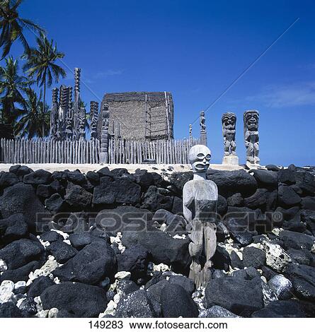 Stock Image - Statues, National Historic Parc Puuhonua O Honaunau, Hawaii . Fotosearch