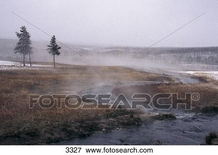 Steam emerging from hot river in winter, Yellowstone National Park, Wyoming, USA View Large Photo Image Stock Photo - Steam emerging from hot river in winter, Yellowstone National Park, Wyoming, USA . Fotosearch