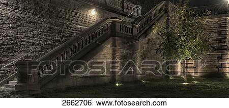 Stock Photograph - Stone bridge lit up at night . Fotosearch