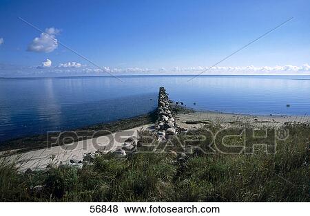 Stock Photo - Stone pier in the sea water . Fotosearch