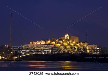 Stock Photography - Theater building lit up at night, Koenig der Loewen, Hamburg, Germany . Fotosearch