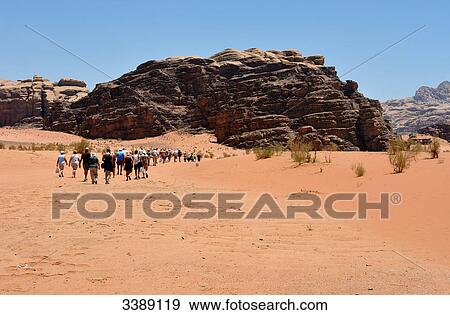 Tourists in Wadi Rum, Jordan, Asia View Large Photo Image Stock Photo - Tourists in Wadi Rum, Jordan, Asia . Fotosearch