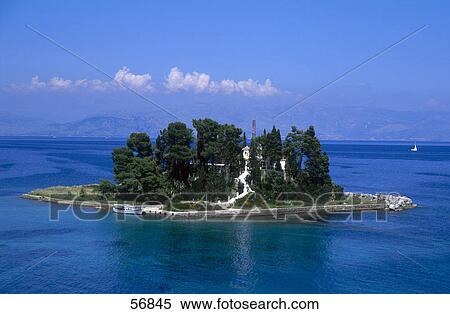Trees on an island with mountains in the background View Large Photo Image Stock Photography - Trees on an island with mountains in the background . Fotosearch