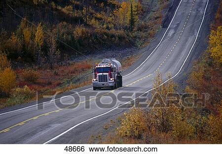 Truck on road, Klondike Highway, Yukon, Canada View Large Photo Image Stock Photograph - Truck on road, Klondike Highway, Yukon, Canada . Fotosearch