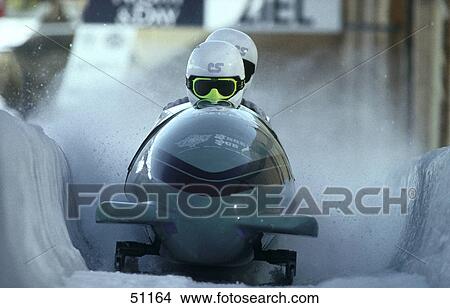 Picture - Two people bobsleighing . Fotosearch