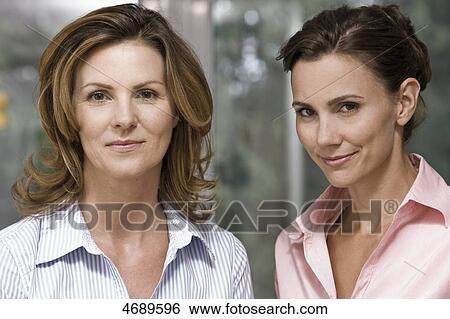 Stock Photograph - Two smiling women side by side . Fotosearch