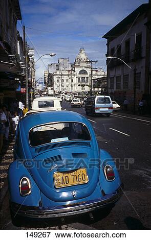 Stock Photo - Vintage car parked on roadside, Salvador, Brazil . Fotosearch