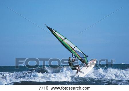 Wind surfer surfing in sea View Large Photo Image Stock Image - Wind surfer surfing in sea . Fotosearch