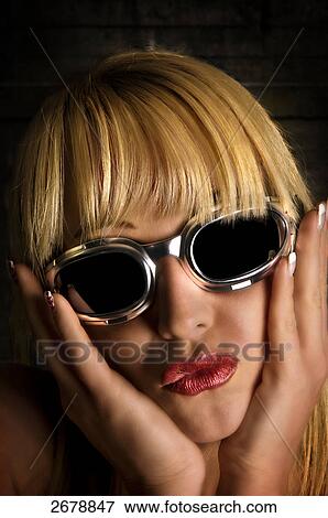 Stock Photo - woman wearing sunglasses, portrait . Fotosearch
