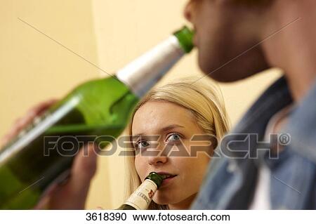 Young couple drinking beer together View Large Photo Image Stock Image - Young couple drinking beer together . Fotosearch