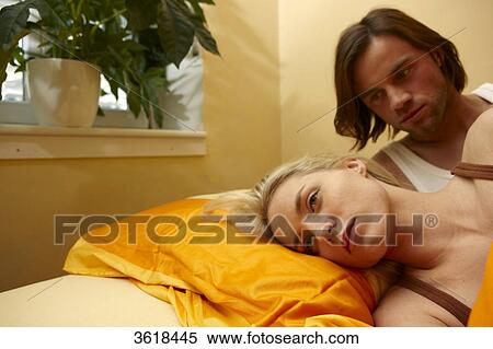 Young couple in bed View Large Photo Image Stock Photography - Young couple in bed . Fotosearch