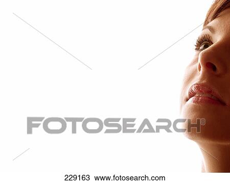 Young woman looking up, part of View Large Photo Image Stock Image - Young woman looking up, part of . Fotosearch