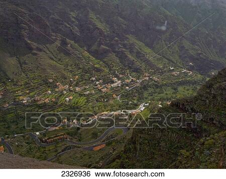 Stock Photograph - Aerial view of houses in valley, La Gomera, Canary Islands, Spain . Fotosearch