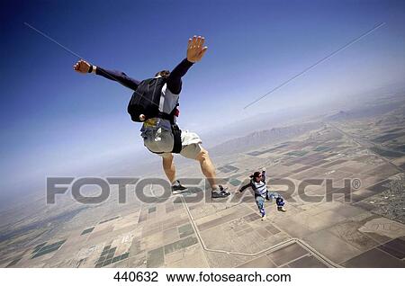 Aerial view on sky divers in the air View Large Photo Image Stock Image - Aerial view on sky divers in the air . Fotosearch