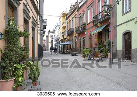 Stock Photography - Alleyway with multicoloured house facades, Gran Canaria, Canary Islands, Spain . Fotosearch