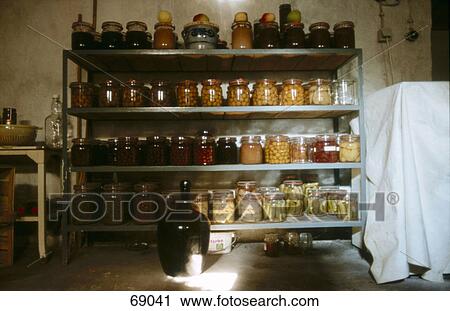 Arrangement of jars of preserves and condiments on a shelf in a pantry View Large Photo Image Stock Image - Arrangement of jars of preserves and condiments on a shelf in a pantry . Fotosearch