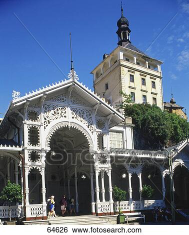 Stock Photograph - Baroque plague column and 19th century spa buildings in spa town, Karlovy Vary, Bohemia, Czech Republic . Fotosearch
