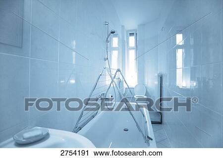 Stock Image - Bathtub and toilet bowl in bathroom . Fotosearch